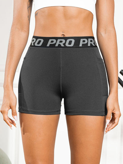 Women's High-Waisted Butt-Lifting Yoga Pants with Mesh Pockets and Three-Quarter Length for Running and Fitness