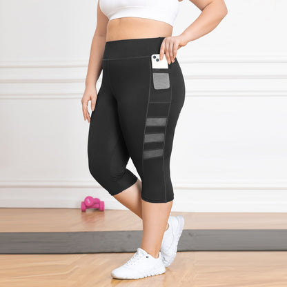 Person wearing black leggings with pocket details on a light wooden floor.